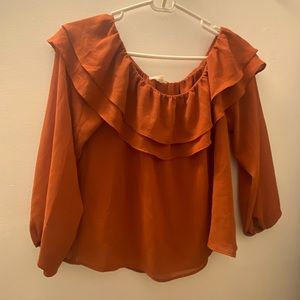 Orange ruffle off the shoulder top